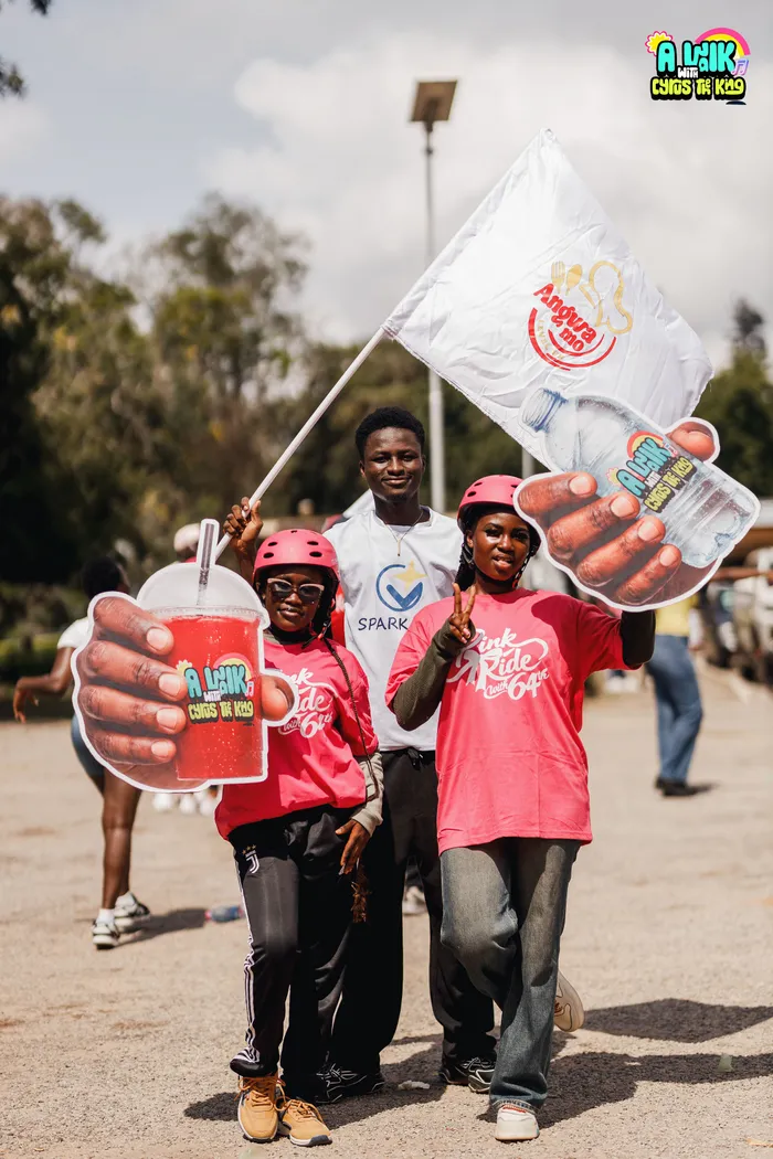 People gathering with the SparkGlim team at a community event